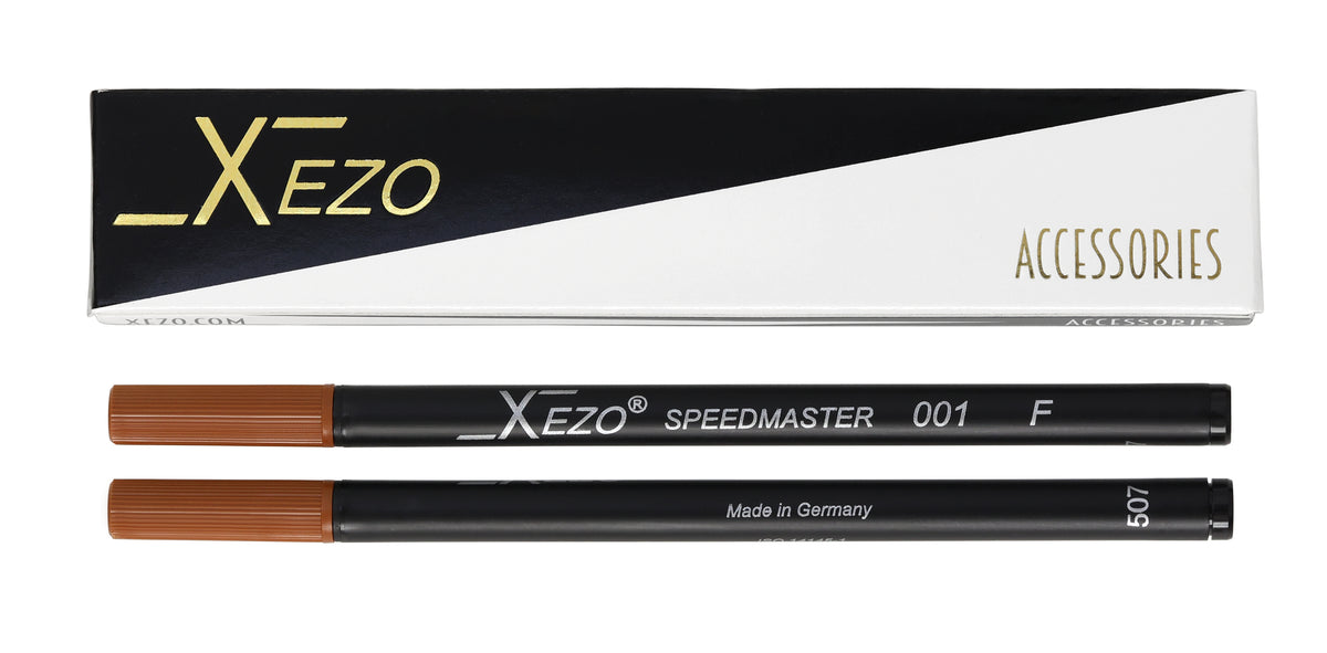 Xezo Speedmaster 001 F eyebrow pencil and its packaging box, showing the brown pigment tip and black barrel of the pencil against a white background.