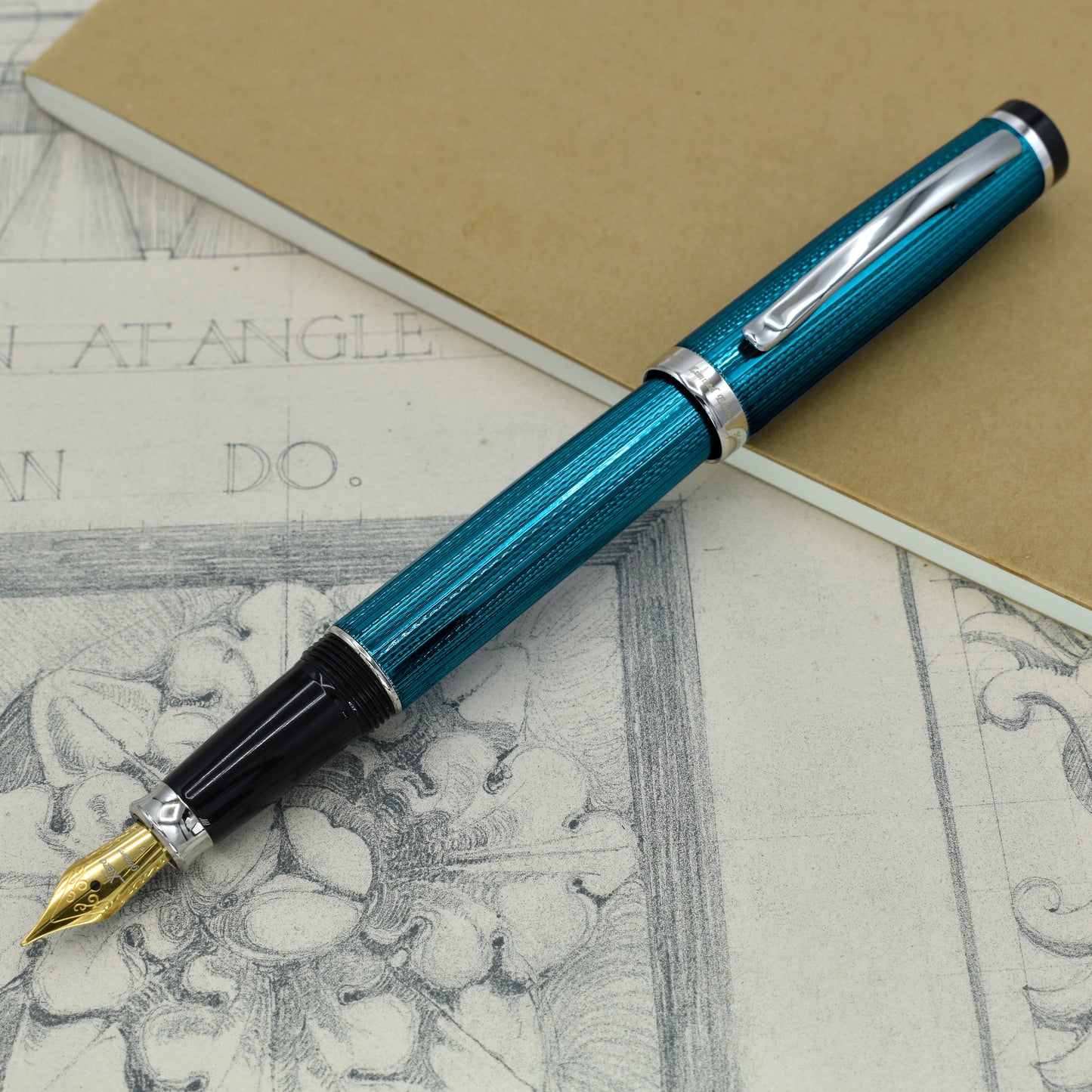 Incognito Blue F-1 Fountain pen with antique architectural sketches and a notebook