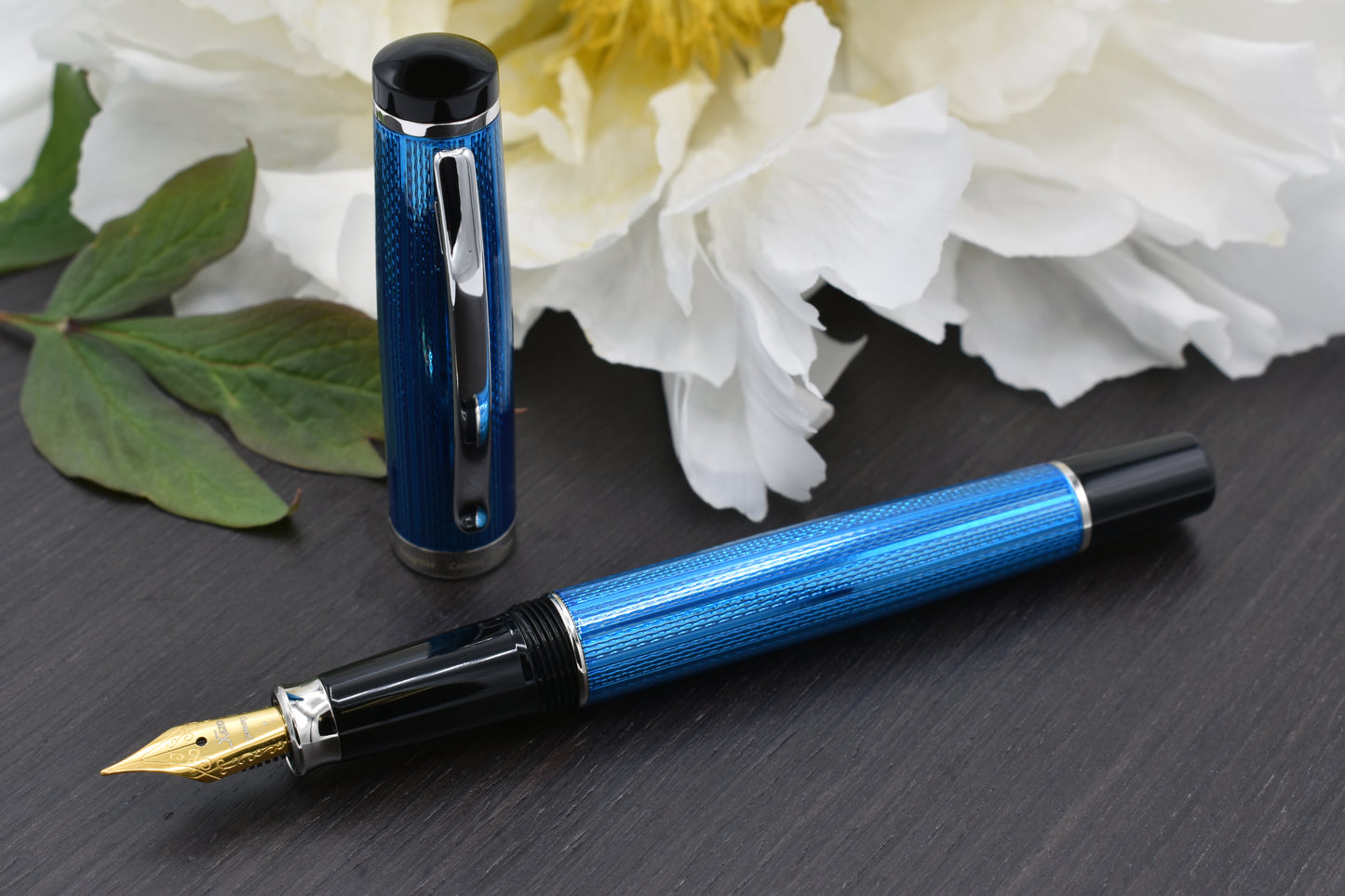 Incognito Blue F-1 Fountain pen with a peony flower