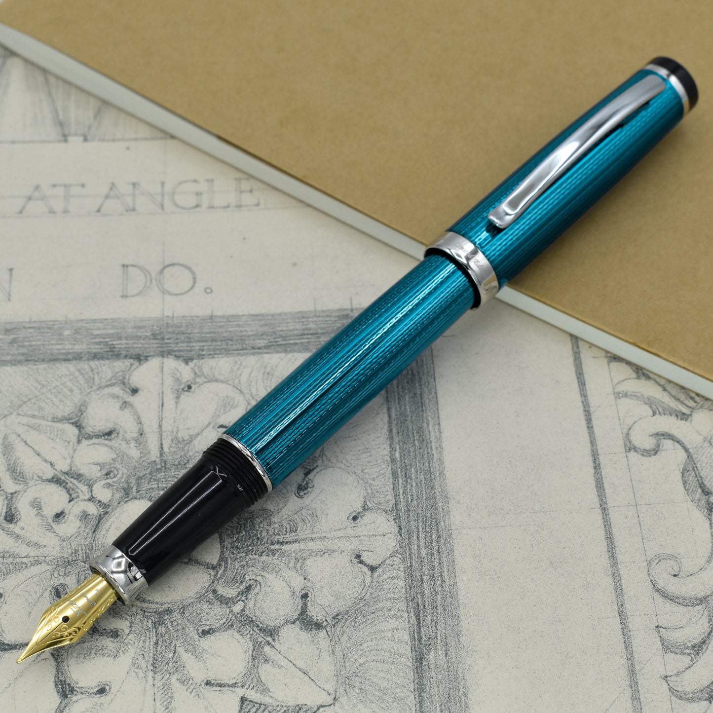 Incognito Blue FM Fountain pen with antique architectural sketches and a notebook