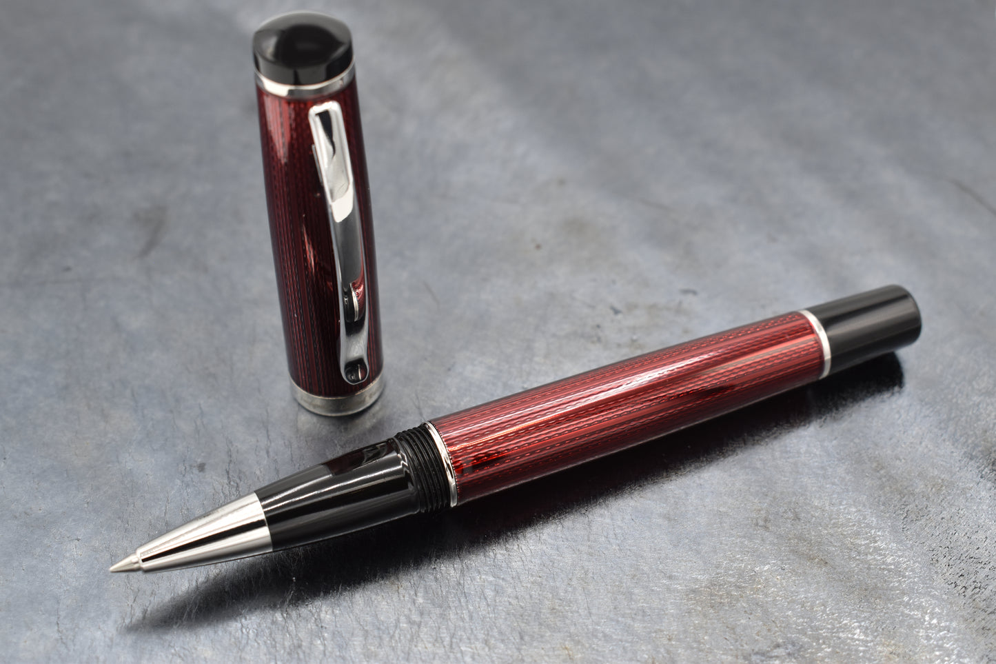 Incognito Burgundy R-1 Rollerball pen on a dark background