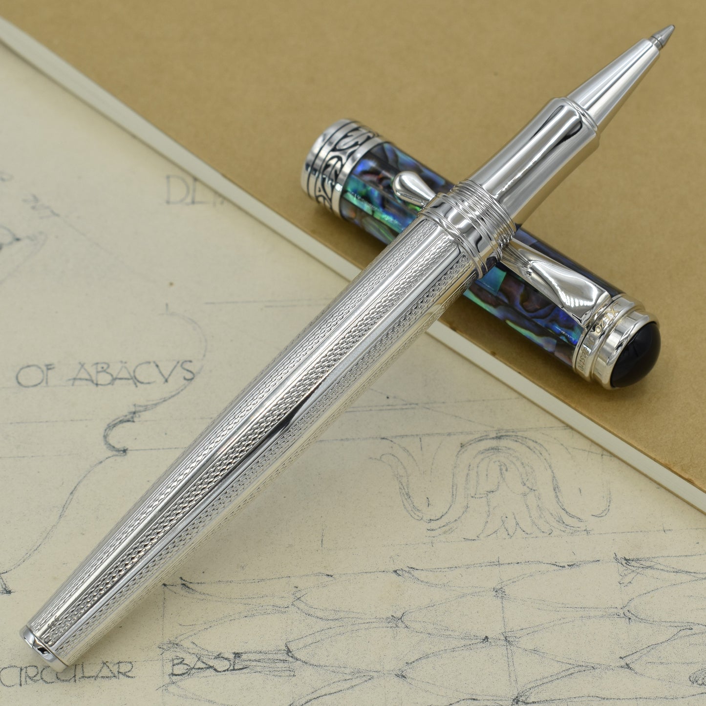 Maestro 925 Sea Shell RP Rollerball pen with antique architectural sketches and a notebook