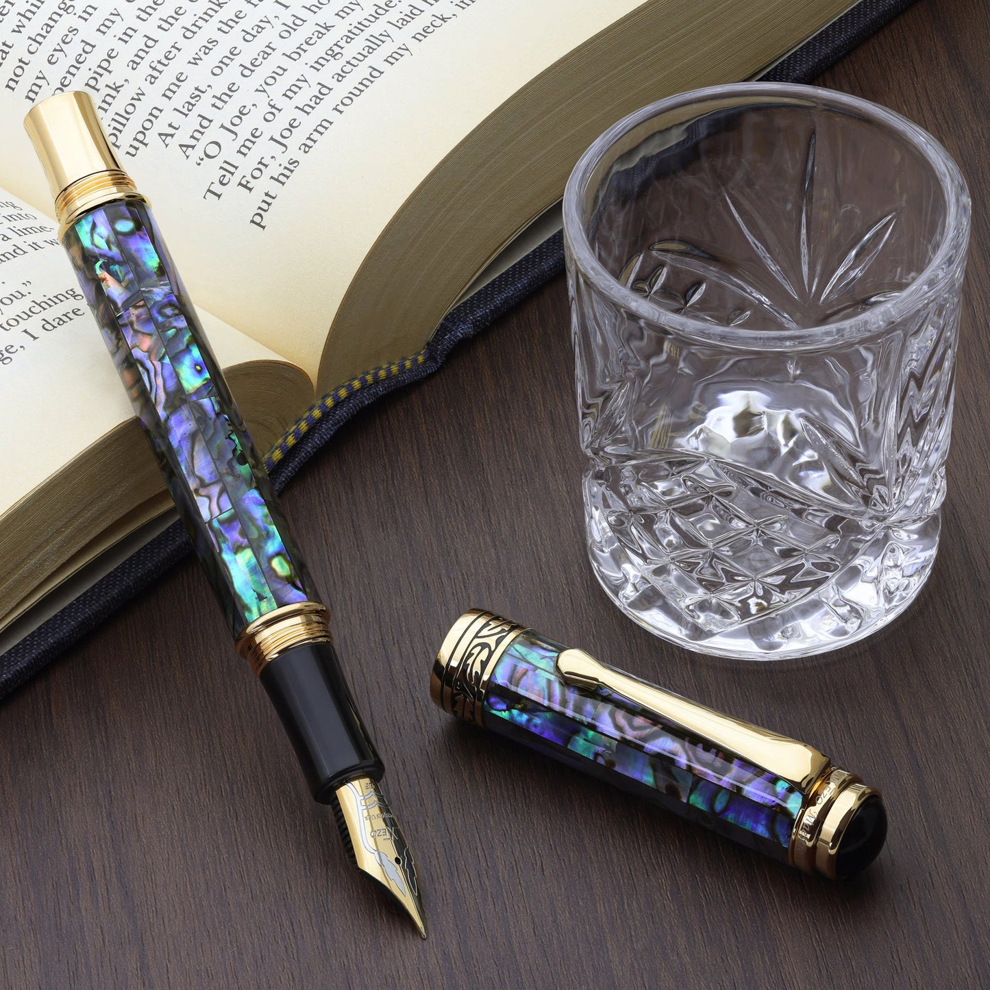 Maestro Sea Shell EFG Fountain pen with a book and glass cup