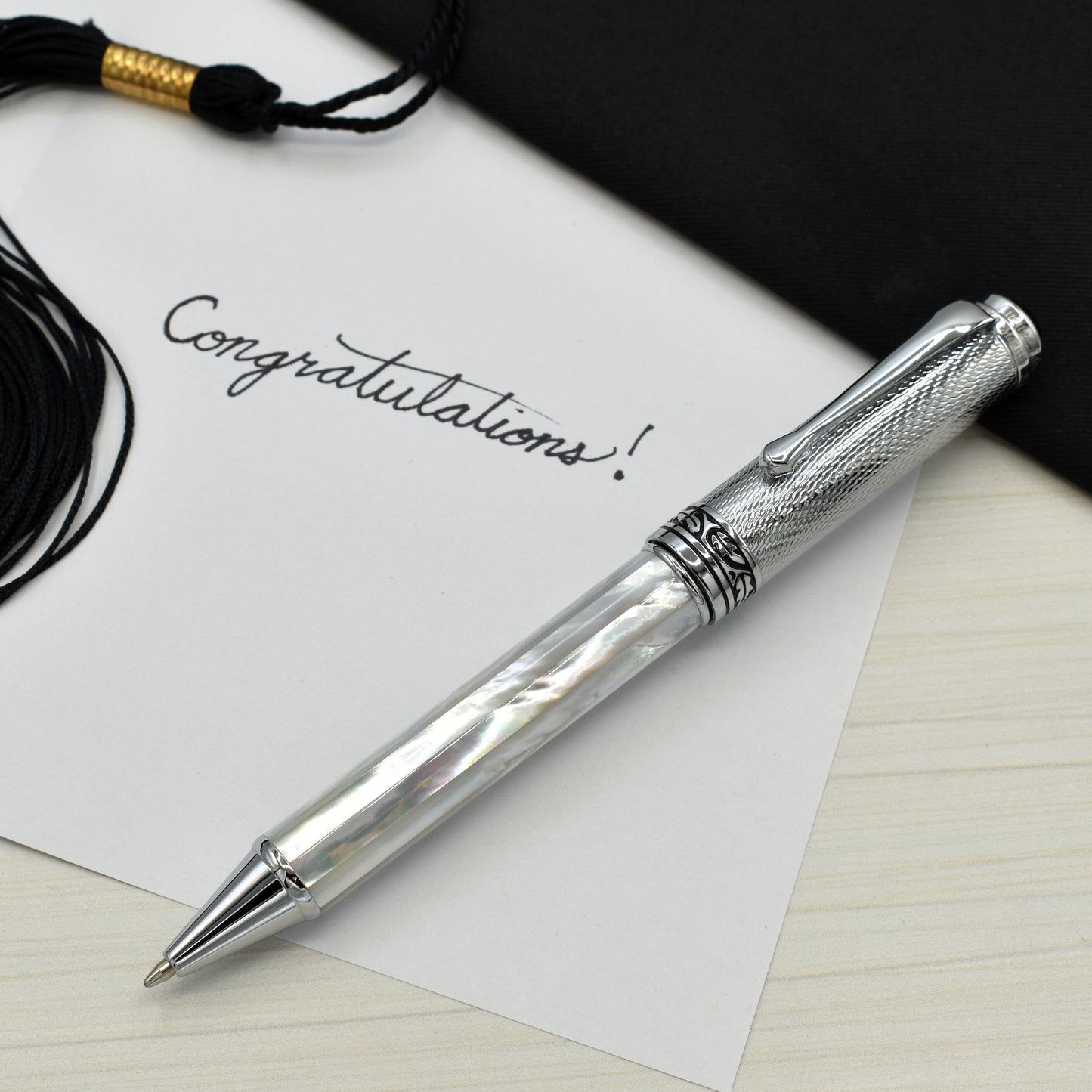 Maestro White MOP Chrome B Ballpoint pen with a graduation and a note that reads "Congratulations!"