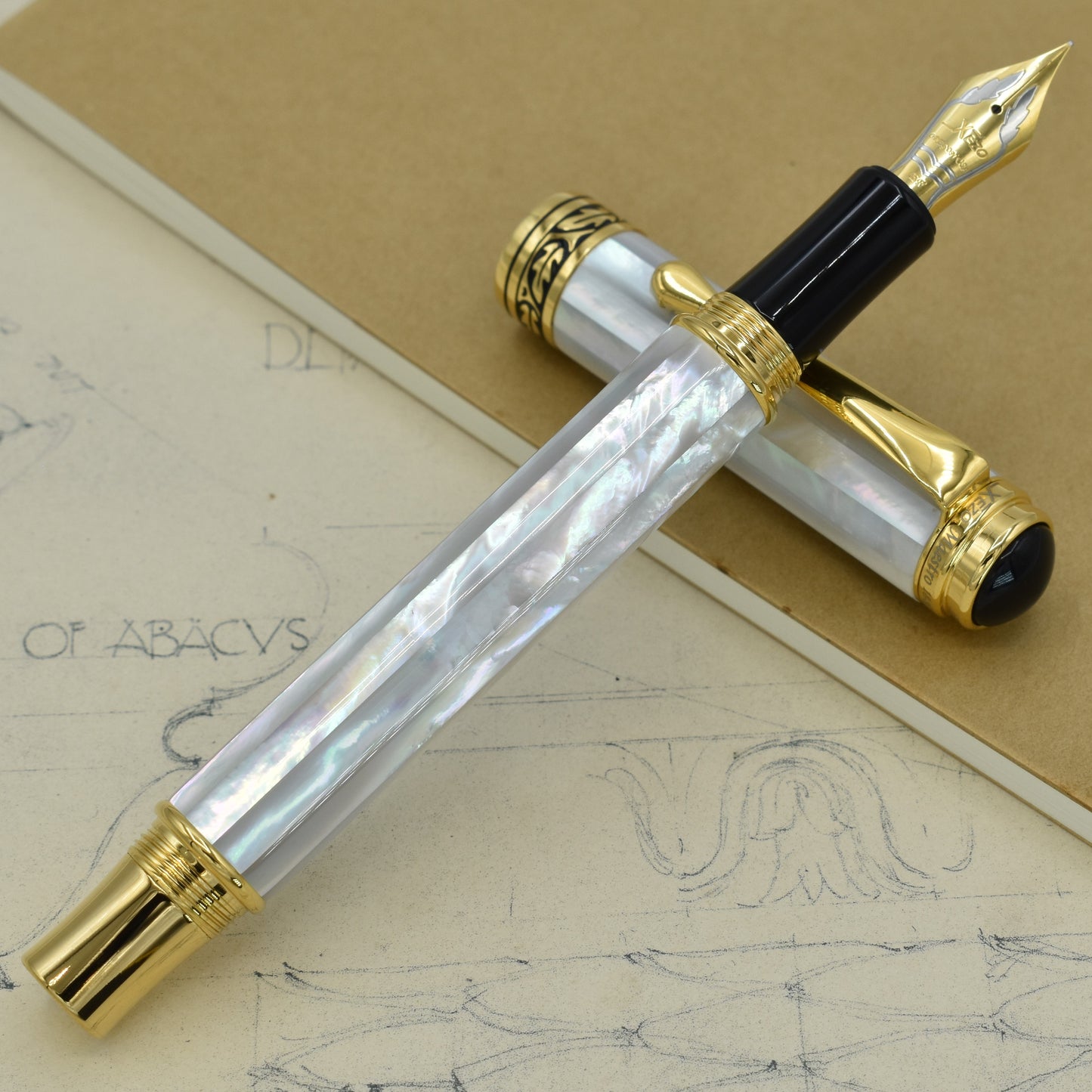 Maestro White MOP EF Fountain pen with antique architectural sketches and a notebook
