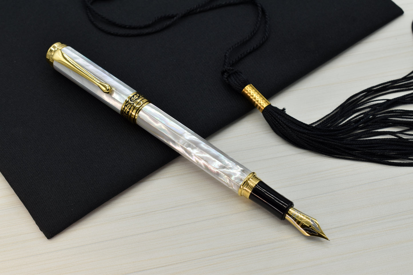 Maestro White MOP EF Fountain pen with a graduation cap