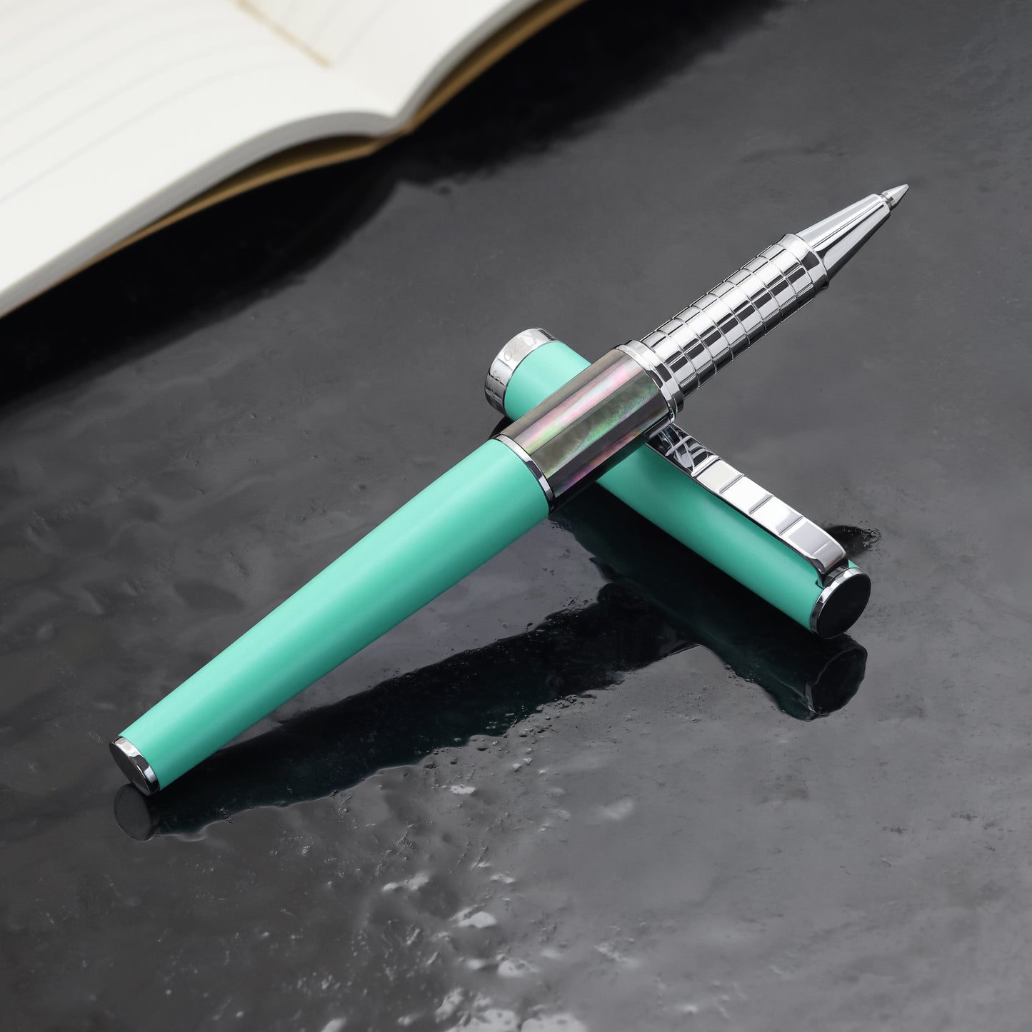 Speed Master Aqua Green R-BC Rollerball pen on a dark background