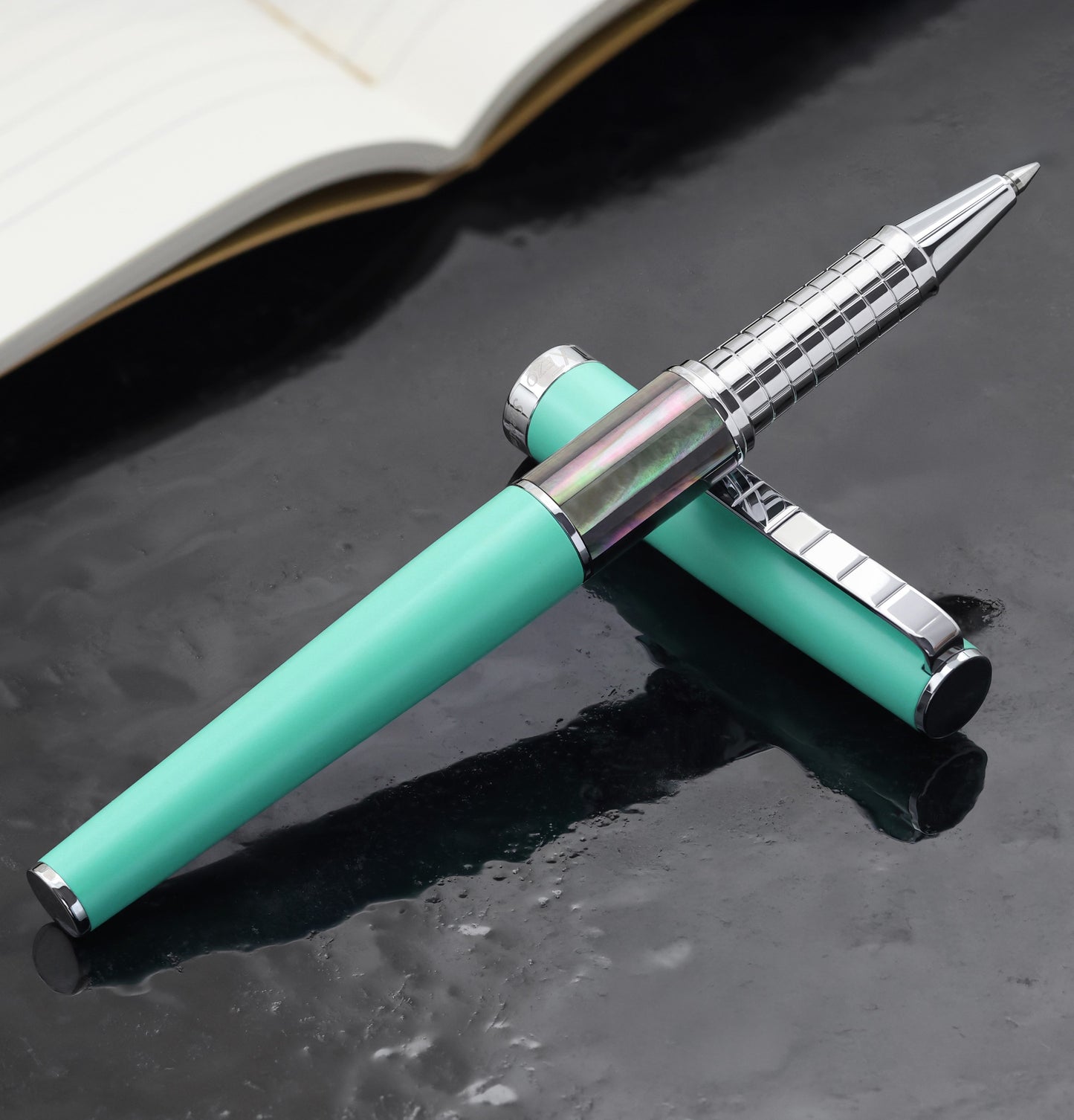 Speed Master Aqua Green R-BC Rollerball pen on a dark background