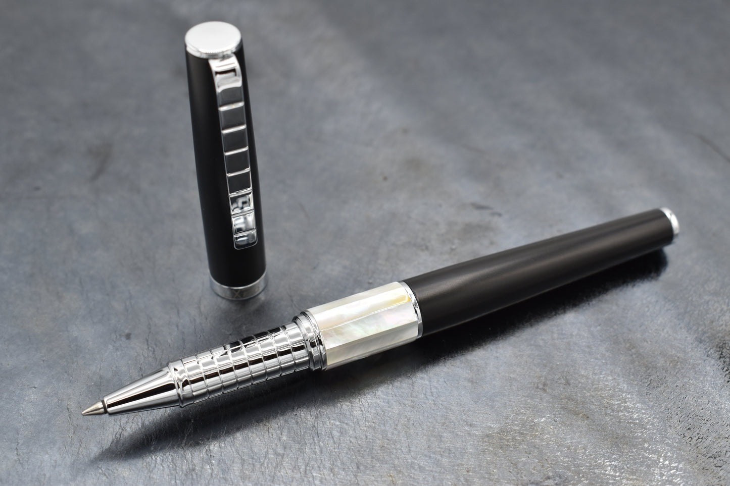 Speed Master Black R-WC Rollerball pen on a dark background
