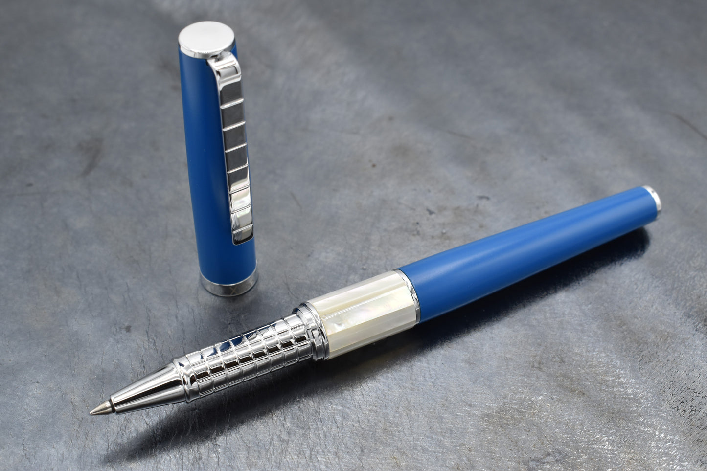 Speed Master Lapis Blue R-WC Rollerball pen on a dark background