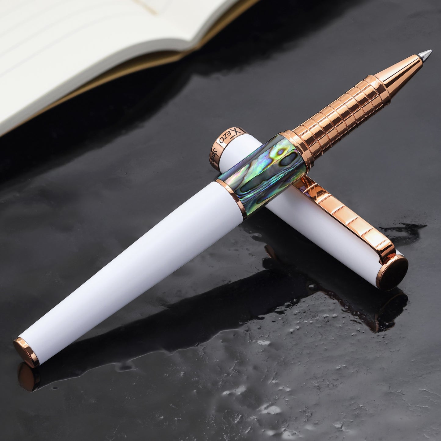 Speed Master White R-ARG Rollerball pen with a book