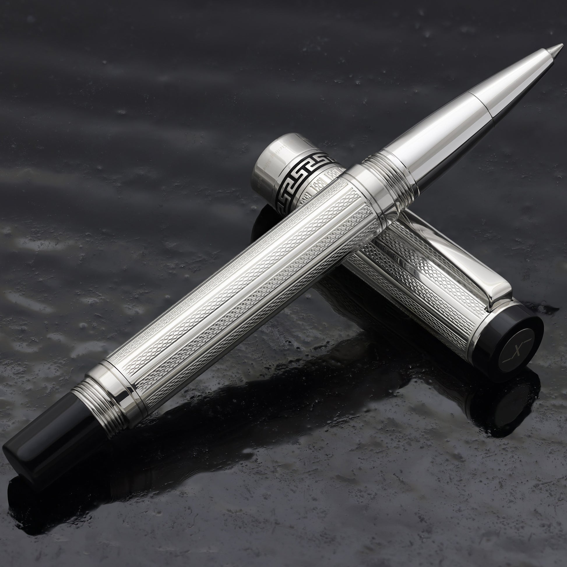Tribune 925 Sterling Silver R Rollerball pen on a dark background