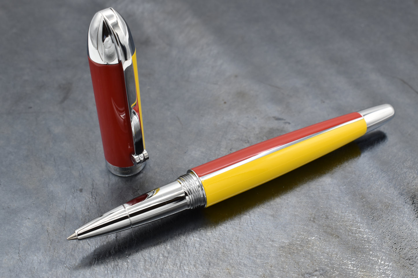 Visionary Aspen/Red R Rollerball pen on a dark background