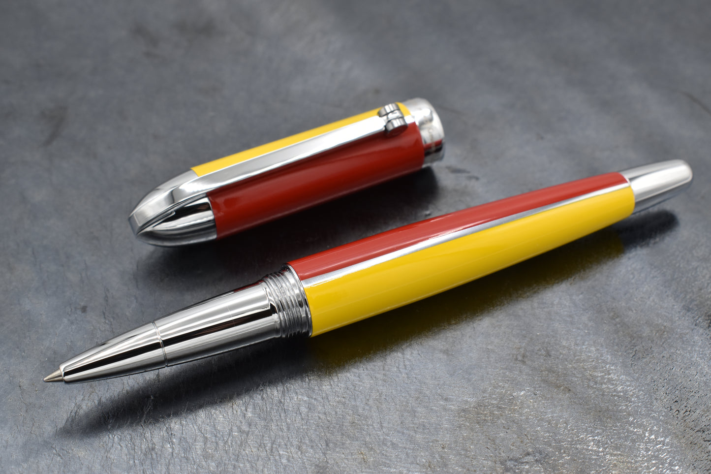 Visionary Aspen/Red R Rollerball pen on a dark background