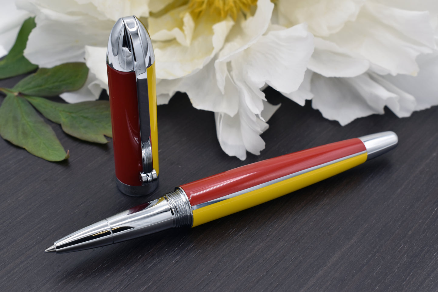 Visionary Aspen/Red R Rollerball pen with a peony flower