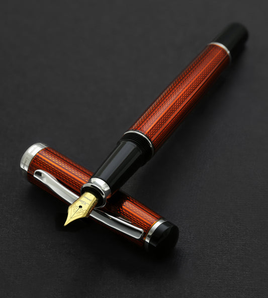 Xezo - Incognito Sunstone FM fountain pen resting on its cap