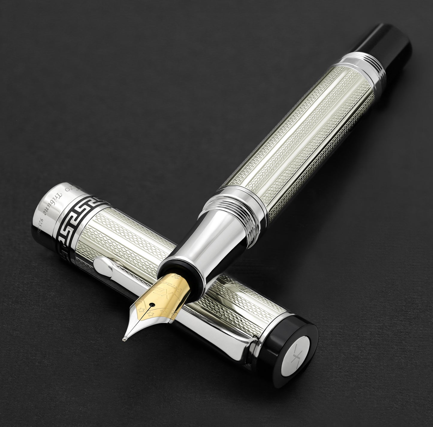 Xezo - Tribune 925 Sterling Silver FM fountain pen resting on its cap