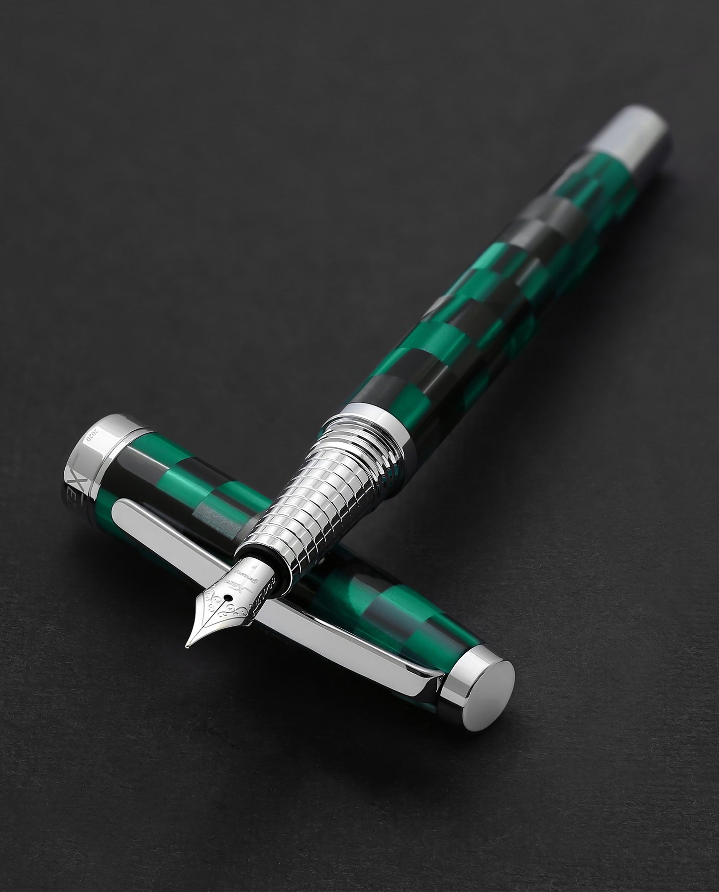 Xezo - Urbanite II Ocean F fountain pen resting on its cap