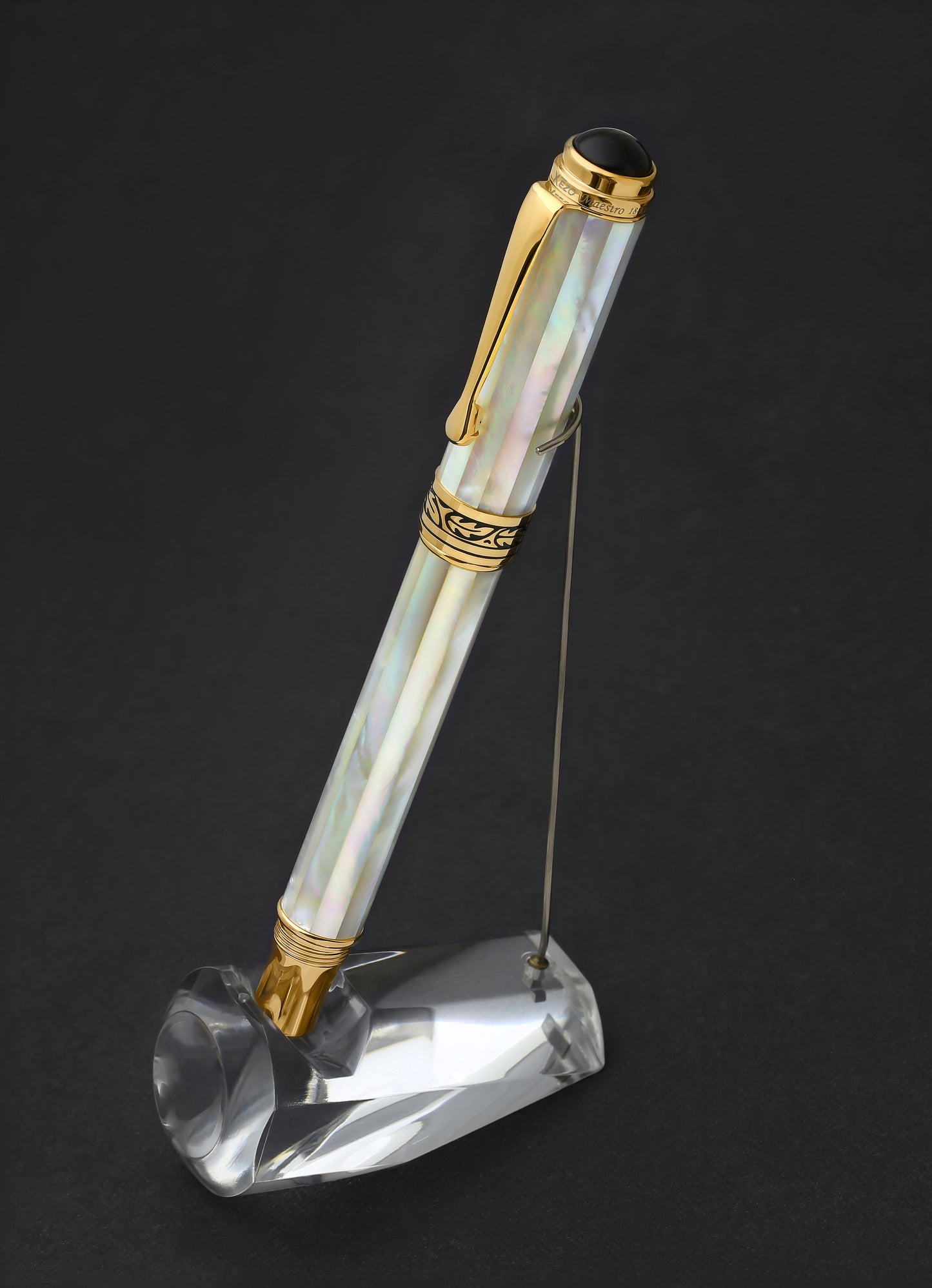 Xezo - Capped Maestro White MOP R rollerball pen standing on a pen stand