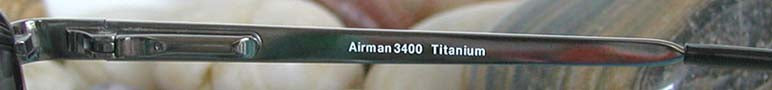 Xezo - Right temple of a pair of Airman 3400 sunglasses from inside. The print in the temple reads "Airman 3400 Titanium".