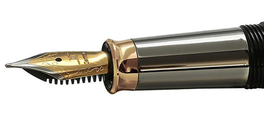 Xezo – Angled view of the side of a Fine Fountain Nib – with gold-plated body, stainless steel tines, and tungsten grip – Compatible with Maestro Tungsten F-2 series. The body of the nib has motif patterns.