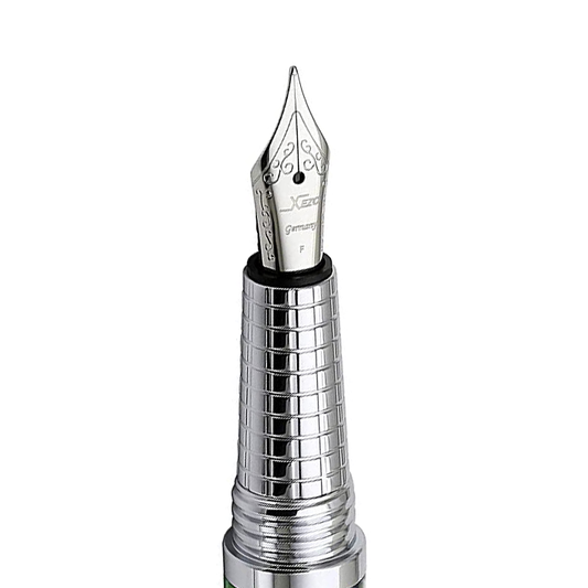 Xezo – Angled view of the front of a Fine Fountain Nib – with stainless steel body and grip – Compatible with  Urbanite II fountain pen series. The body of the nib has motif patterns.