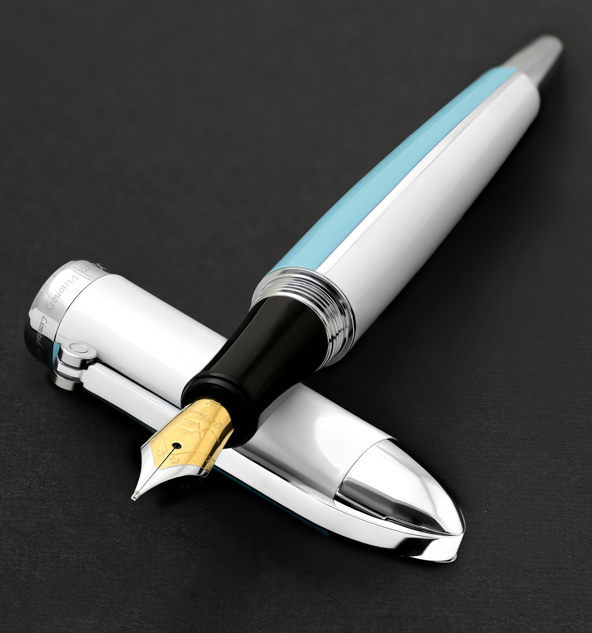 Xezo - Visionary Sky Blue/White FM Fountain pen resting on its cap