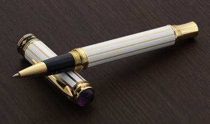 Xezo Maestro® Streamliner Amethyst R pen and cap displayed on a dark brown wooden surface.