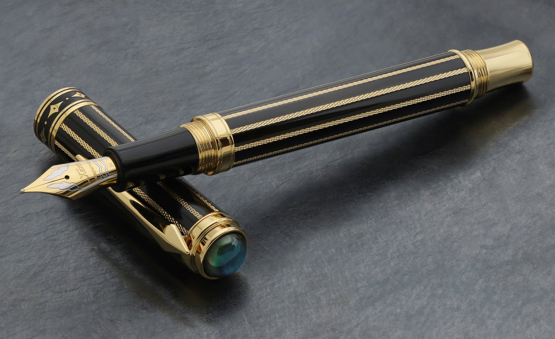 Xezo Maestro® Streamliner Labradorite FM pen and cap displayed on a textured dark gray surface.