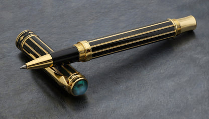 A Xezo Maestro® Streamliner Labradorite R pen and cap displayed on a textured dark gray surface.