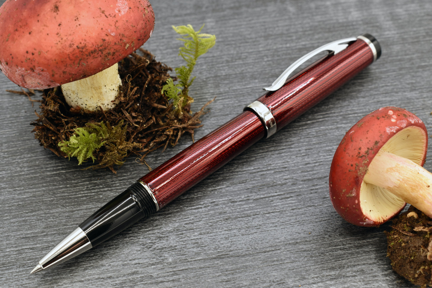 Incognito Burgundy R-1 Rollerball pen with whimsical red mushrooms