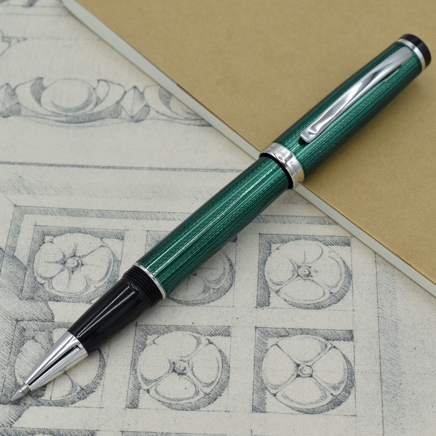 Incognito Forest R Rollerball pen with antique architectural sketches and a notebook