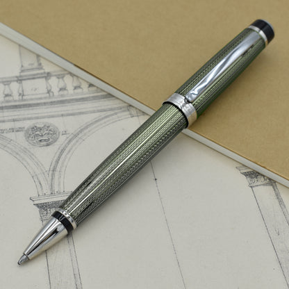 Incognito Zinc B Ballpoint pen with antique architectural sketches and a notebook
