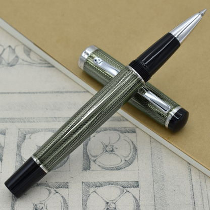 Incognito Zinc R-1 Rollerball pen with antique architectural sketches and a notebook