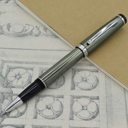 Incognito Zinc R-1 Rollerball pen with antique architectural sketches and a notebook