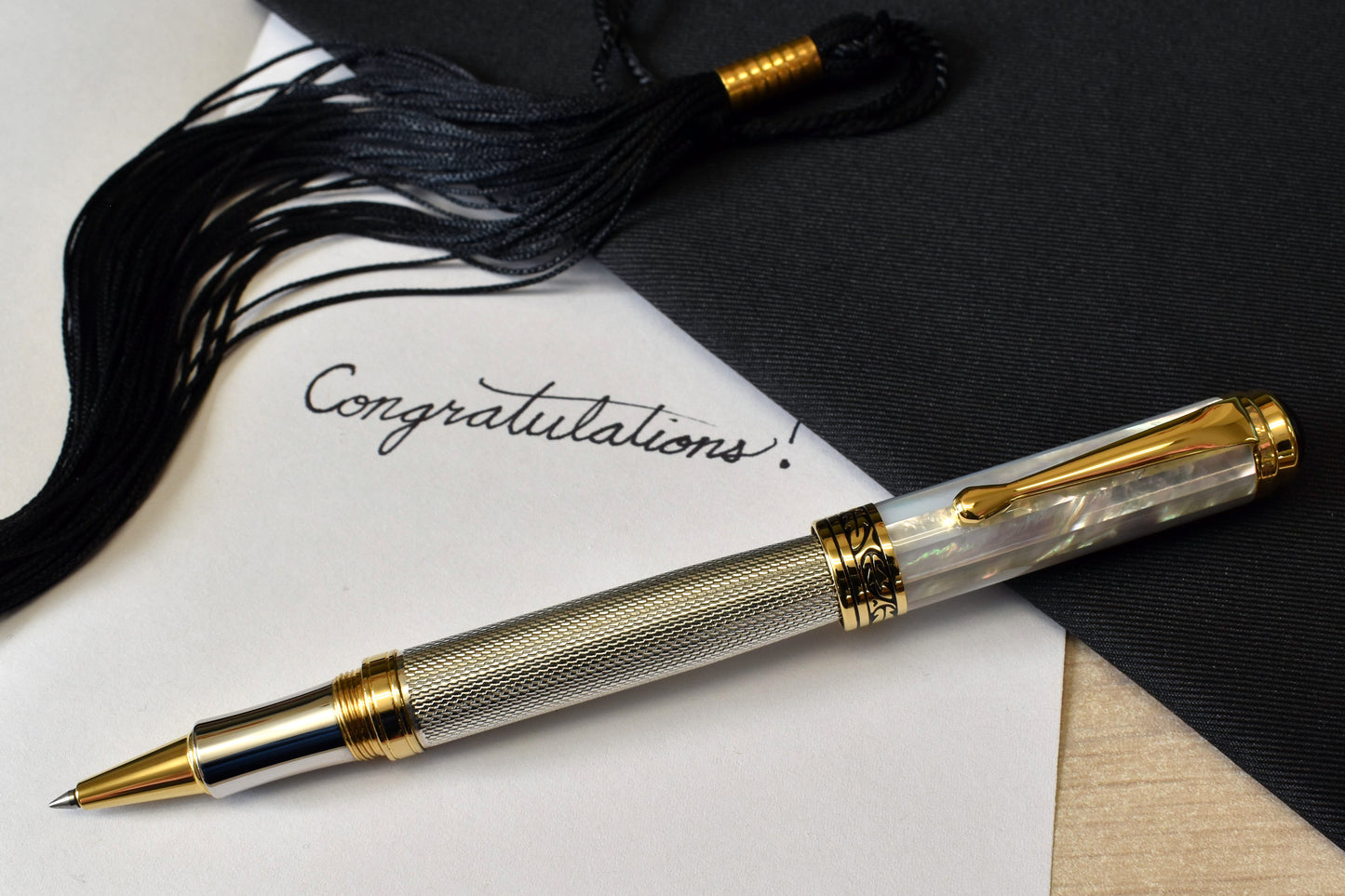 Maestro 925 White MOP R Rollerball pen with a graduation and a note that reads "Congratulations!"