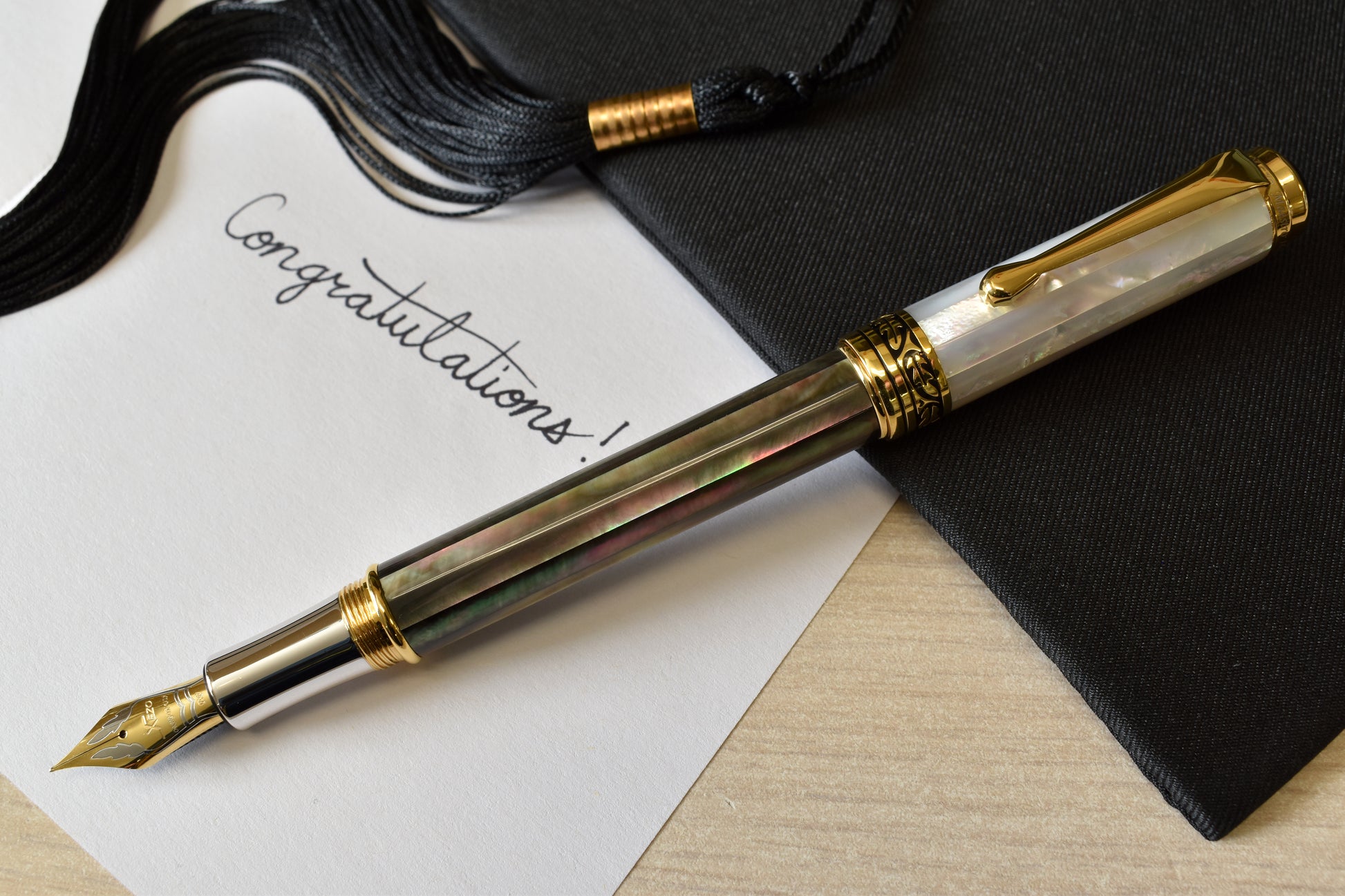 Maestro Black and White MOP EFG Fountain pen with a graduation cap and a note that reads "Congratulations!"