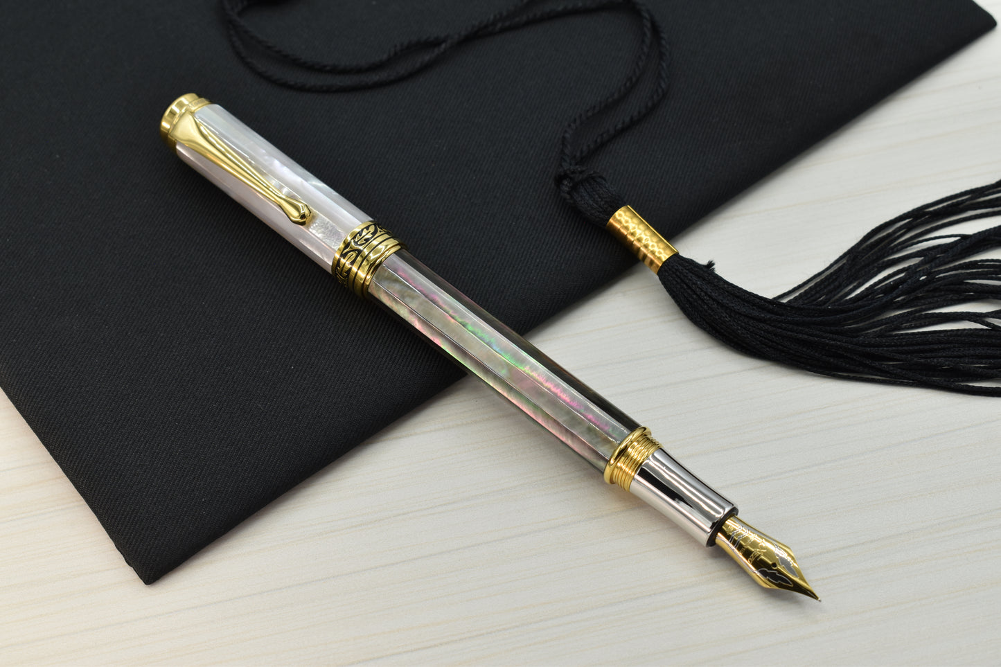 Maestro Black and White MOP EFG Fountain pen with a graduation cap