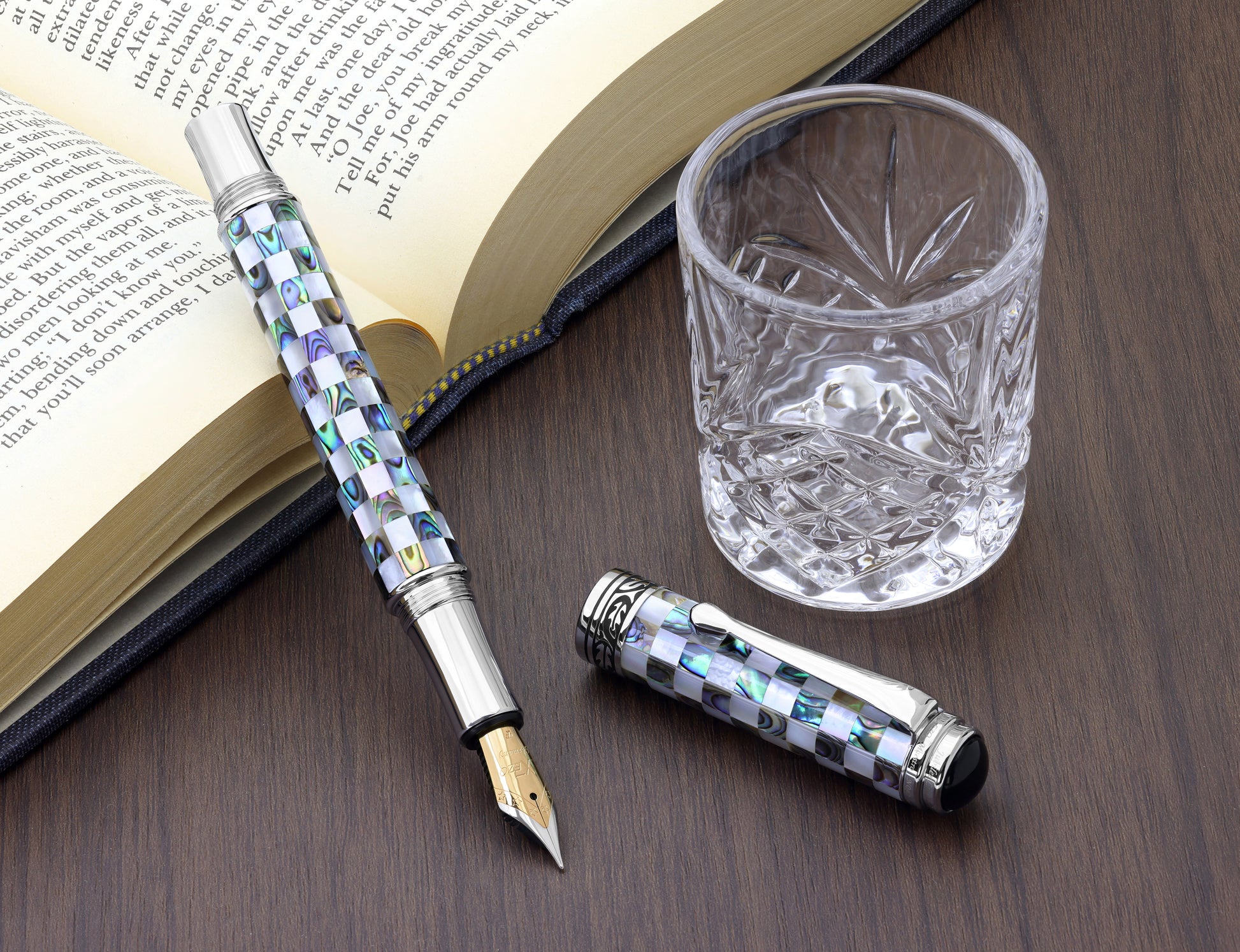 Maestro Jubilee Classic Of The Ocean EF Fountain pen with a book and glass cup