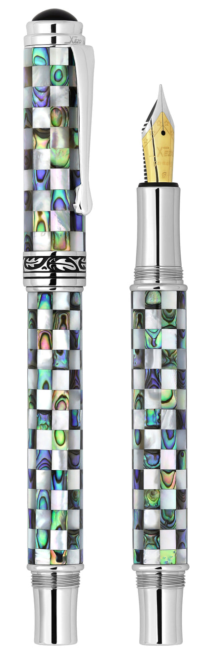 Xezo - Vertical view of two Maestro Jubilee Classic Of The Ocean EF Fountain pens; the one on the left is capped, and the one on the right is uncapped
