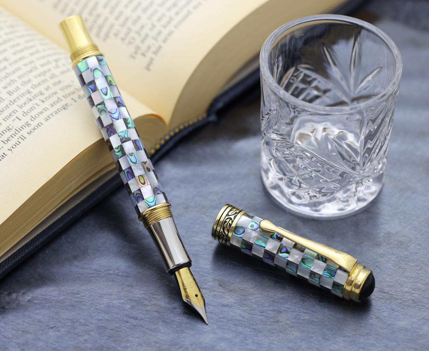 Maestro Jubilee Classic Of The Ocean FG Rollerball pen with a book and glass cup