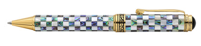 A luxury ballpoint pen with a checkered pattern of iridescent mother-of-pearl and paua abalone shell inlay and polished gold-tone metal accents, including the clip, tip, and trim. Pen laying in horizontal position.