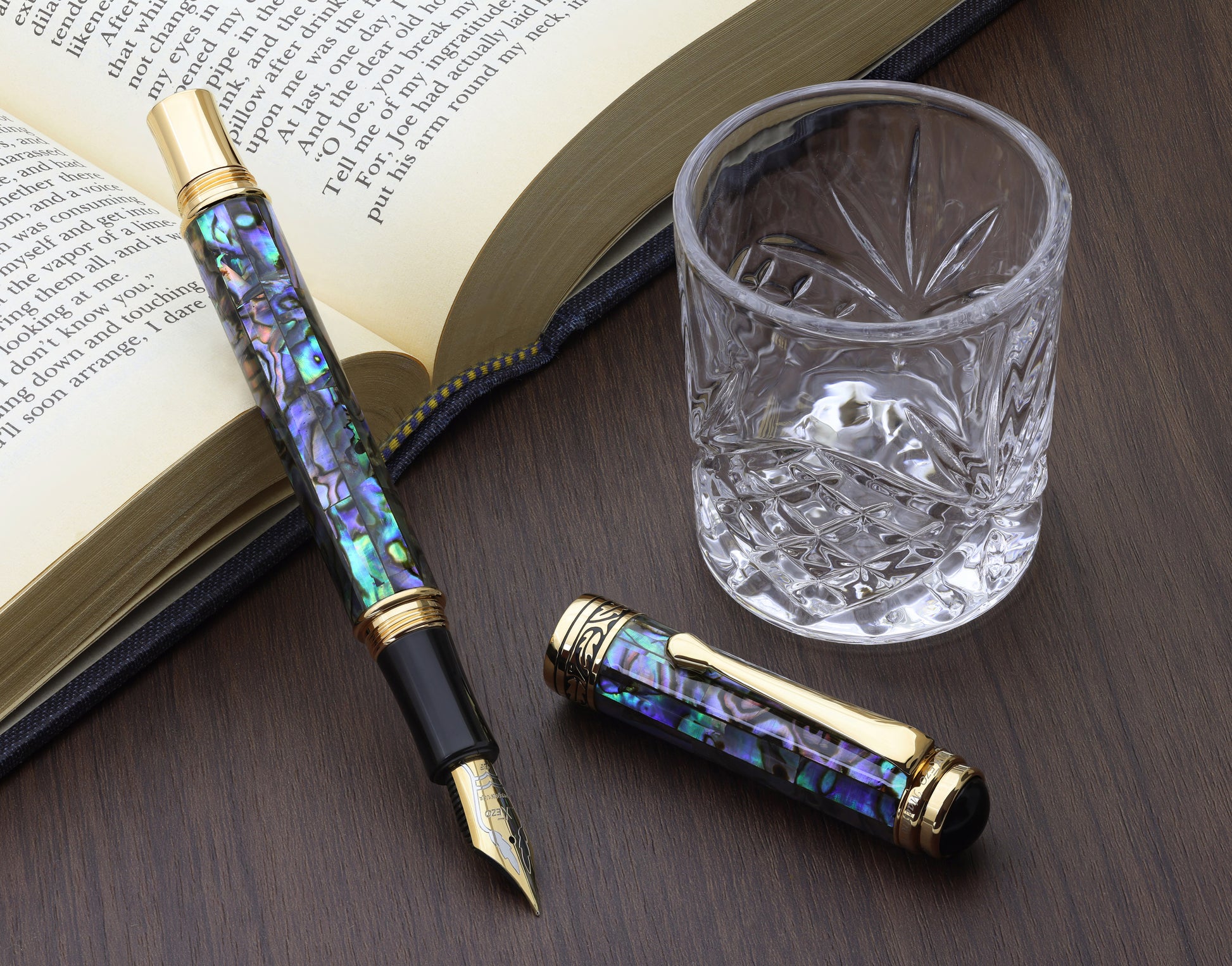 Maestro Sea Shell EFG Fountain pen with a book and glass cup