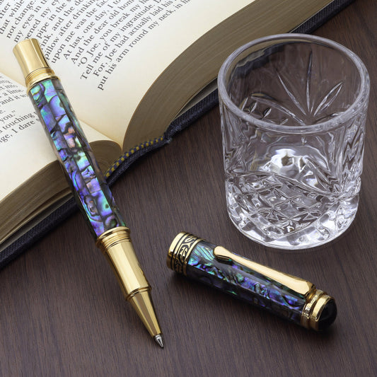 Maestro Sea Shell RPG-1A Rollerball pen with a book and glass cup