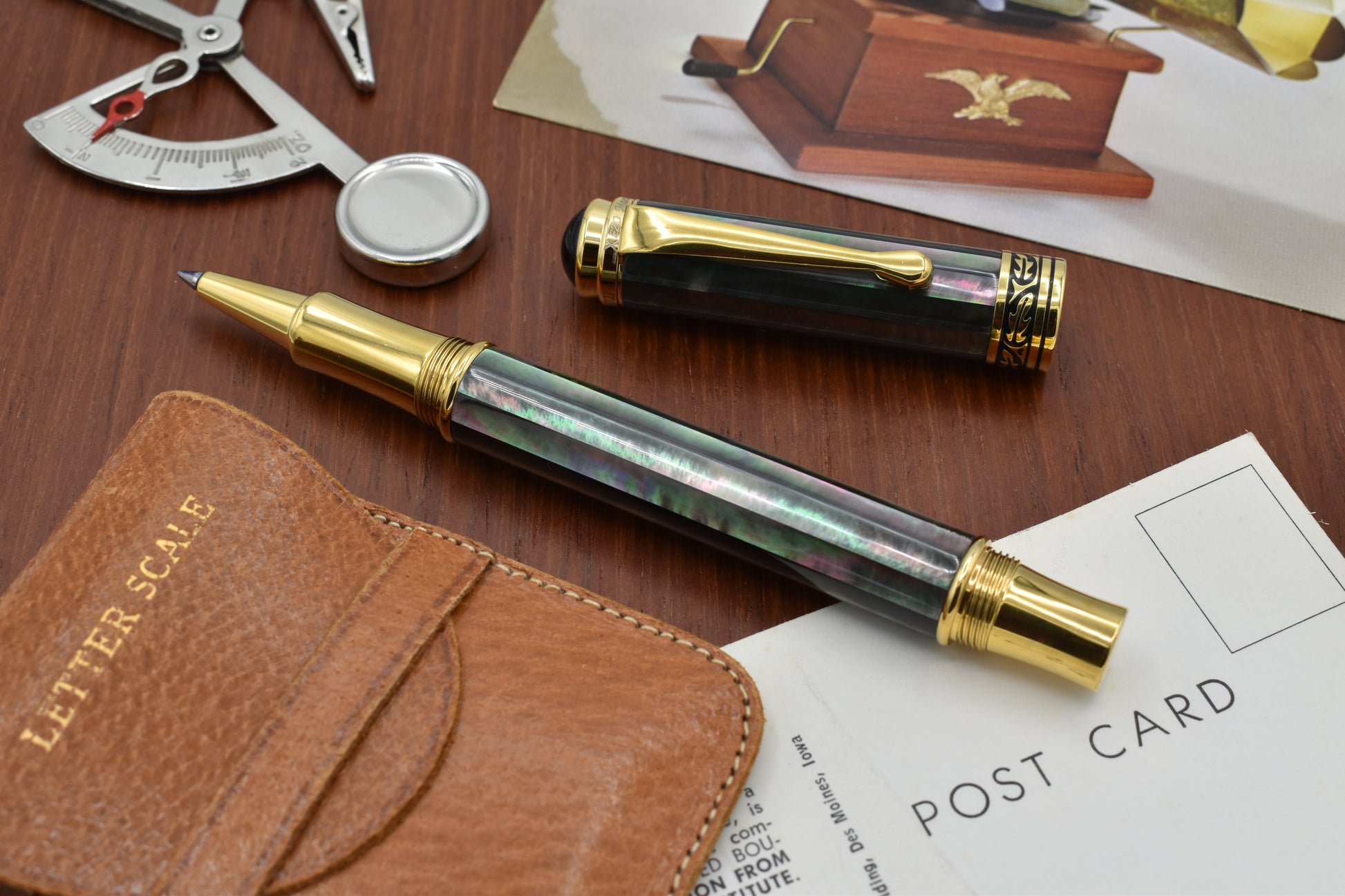 Maestro Tahitian Black MOP R Rollerball pen with vintage letter scale and post cards