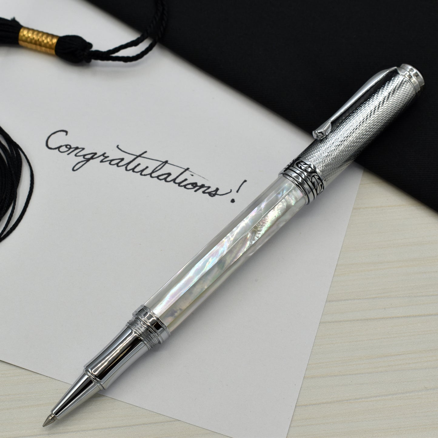 Maestro White MOP Chrome R-2 Rollerball pen with a graduation and a note that reads "Congratulations!"