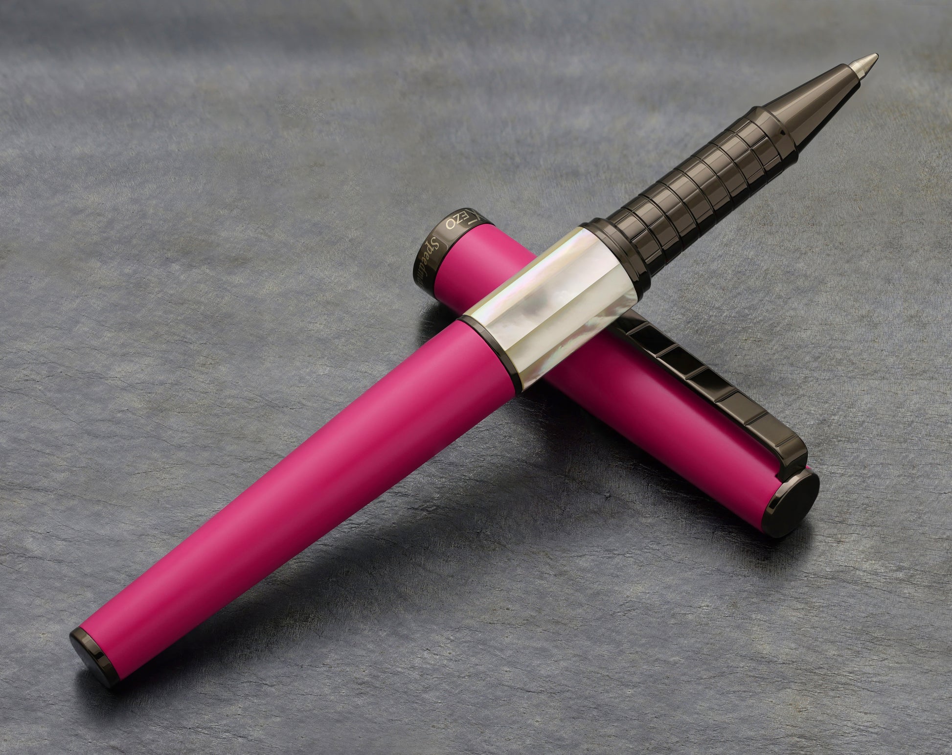 Speed Master Cerise R-WGM Rollerball pen on a dark background