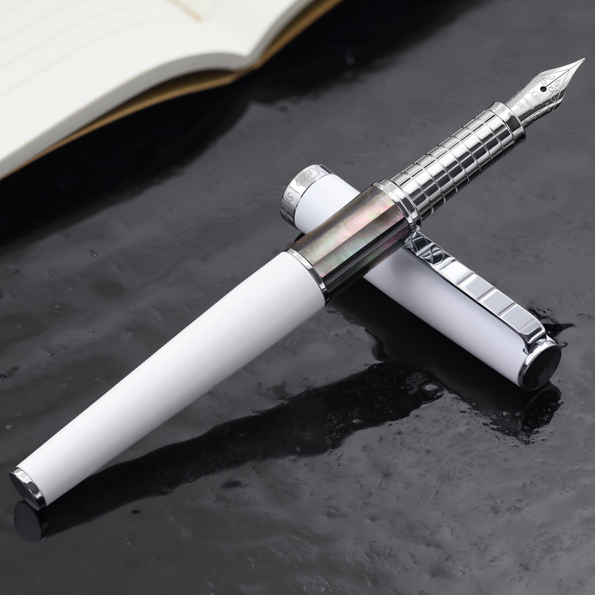 Speed Master White EF-BC Fountain pen with a book