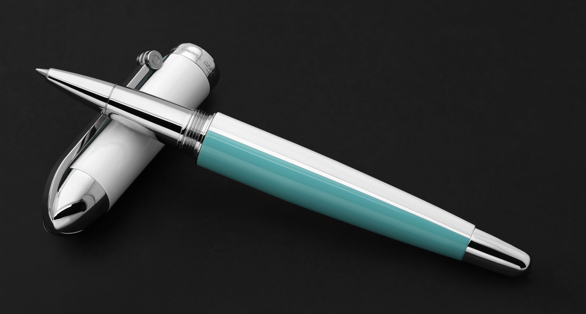 Xezo - Visionary Sky Blue/White R Rollerball pen resting on its cap