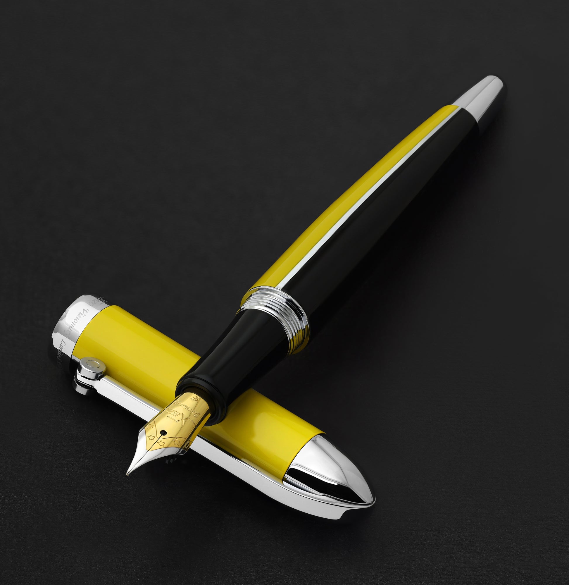 Xezo - Visionary Speed Yellow/Black F Fountain pen resting on its cap